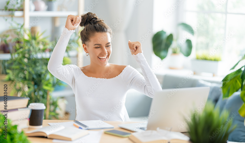 woman working on laptop at home.