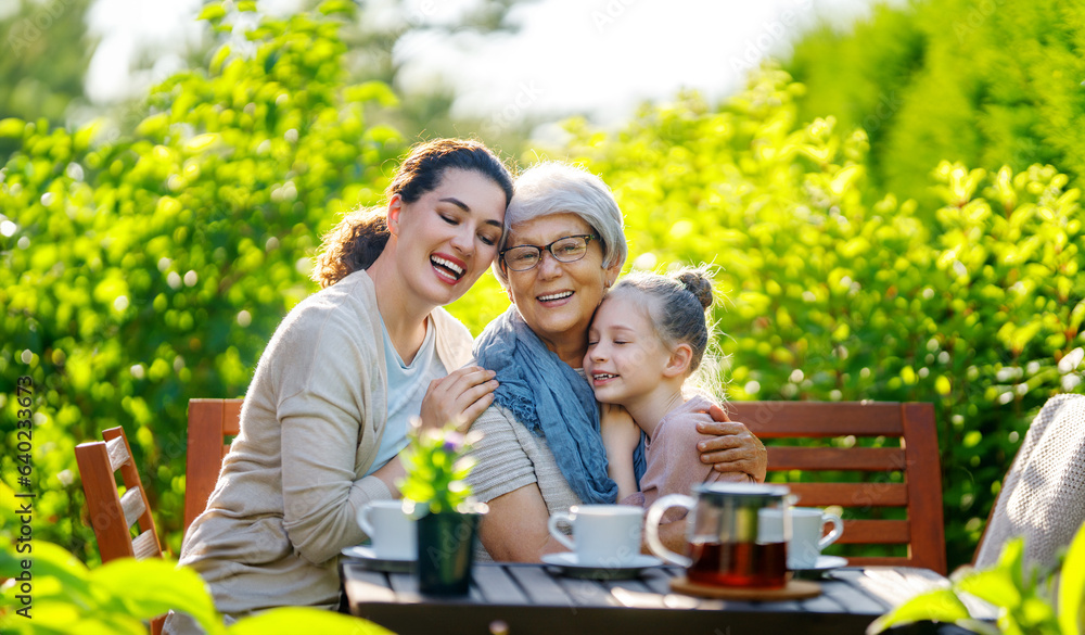 family drinking tea in the garden