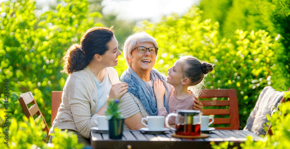 family drinking tea in the garden