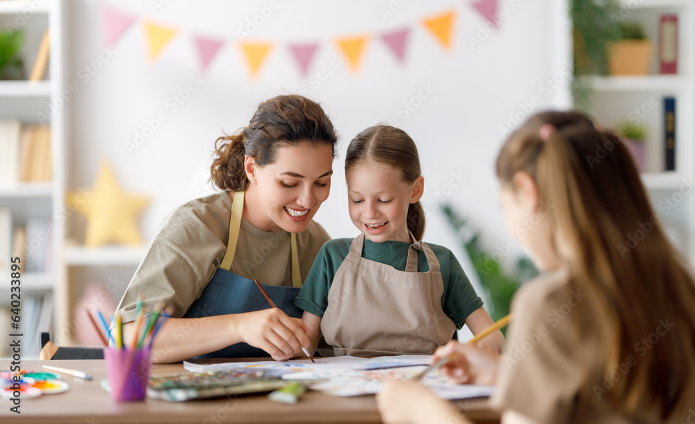 kids and teacher at the art class