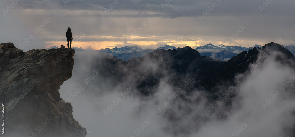 Adventurous Woman Standing on top of Mountain Cliff. Extreme Adventure Composite.