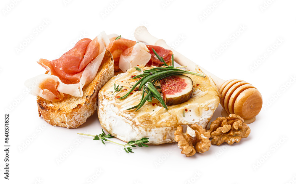 Tasty baked Camembert cheese and sandwiches with jamon on white background