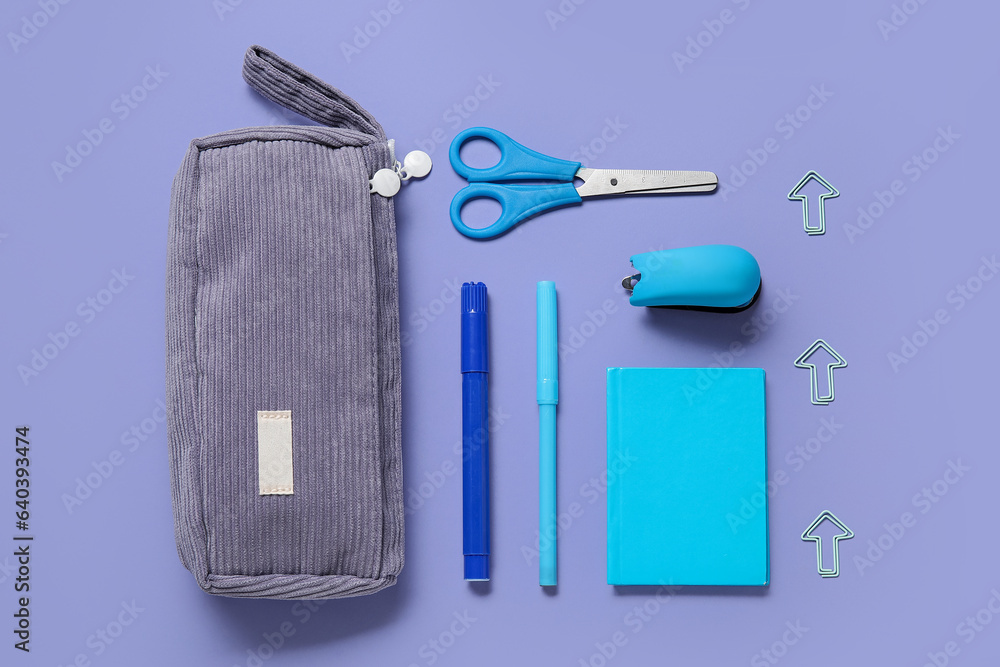 Pencil case and school stationery on purple background