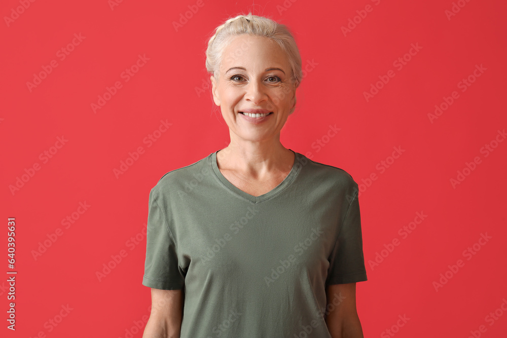 Mature woman on red background