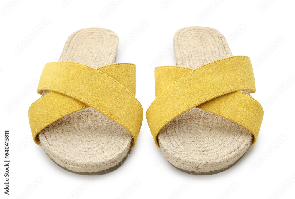 Stylish yellow sandals on white background