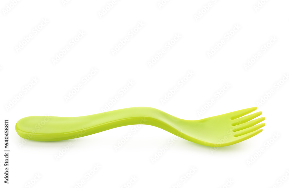 Green plastic fork for baby isolated on white background