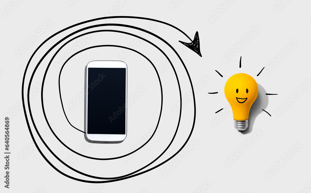 Creativity, inspiration, idea concept with light bulb and smartphone - Flat lay