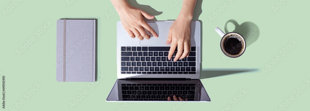 Person using a laptop computer from above