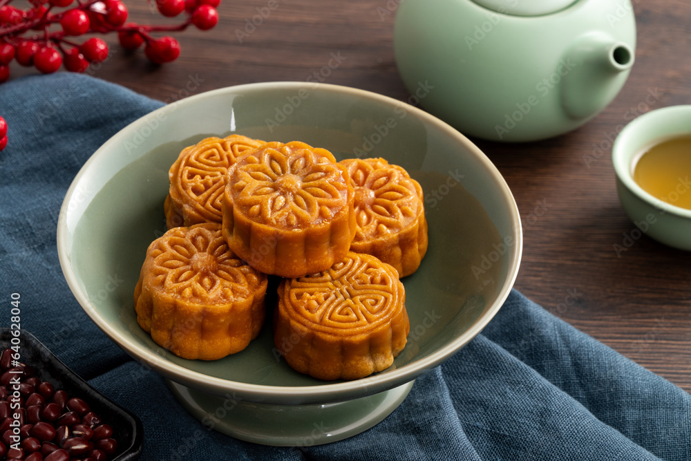 Delicious Cantonese moon cake for Mid-Autumn Festival food mooncake on wooden table background.