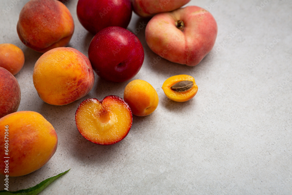 Summer fruits on grey surface