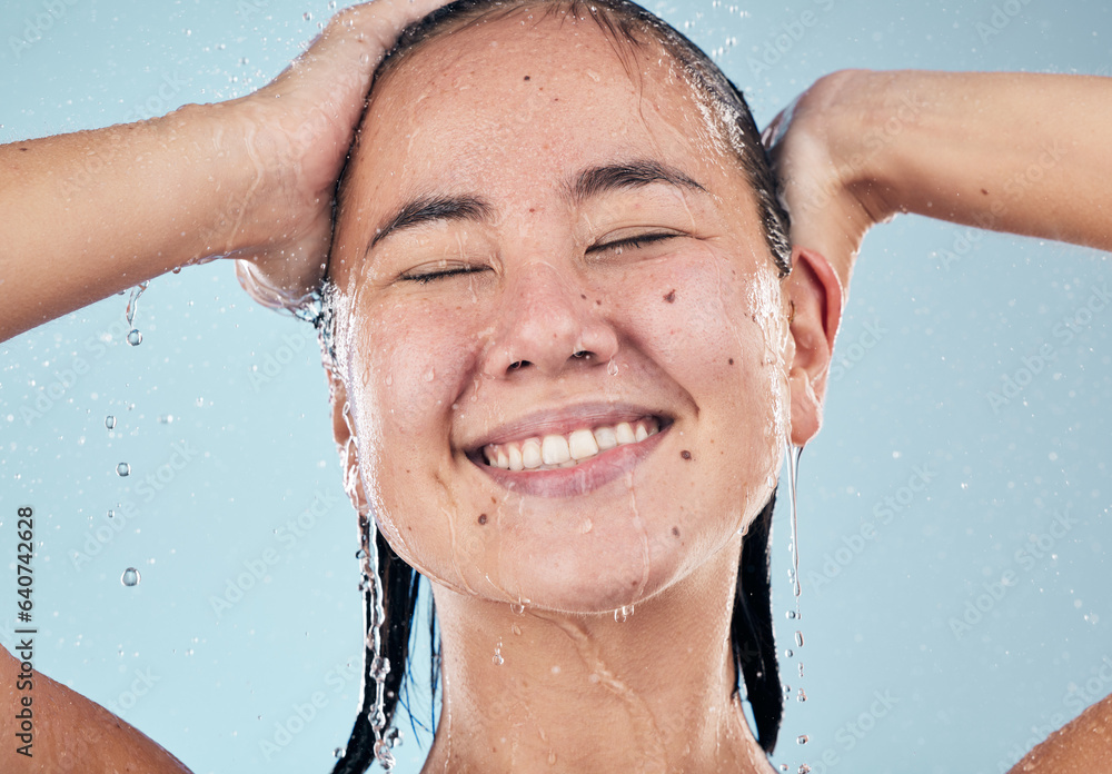 Shower, face or happy woman cleaning hair for skincare or wellness in studio on blue background. Sha