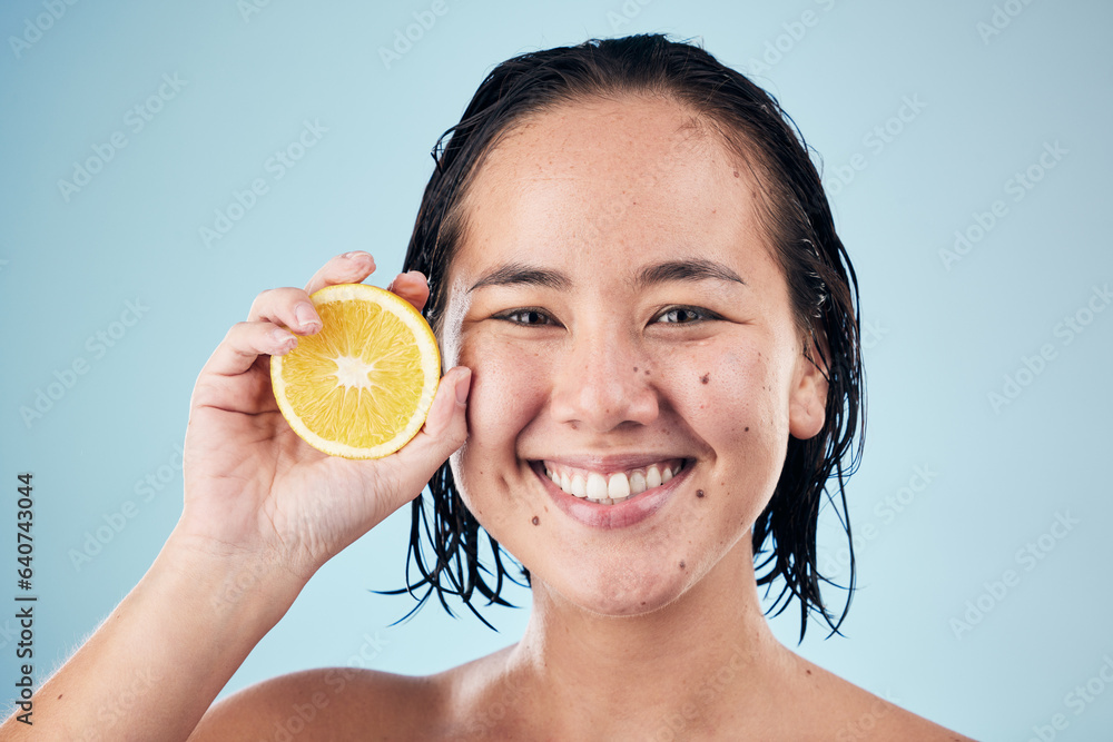 Portrait, smile or happy woman with orange for skincare or beauty in studio on blue background. Resu