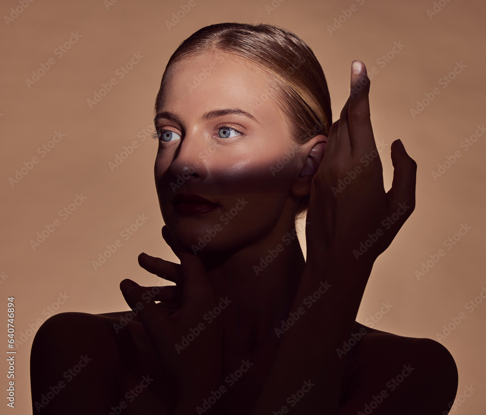 Spotlight, face or woman in shadow with beauty and creative aesthetic in studio background. Light on