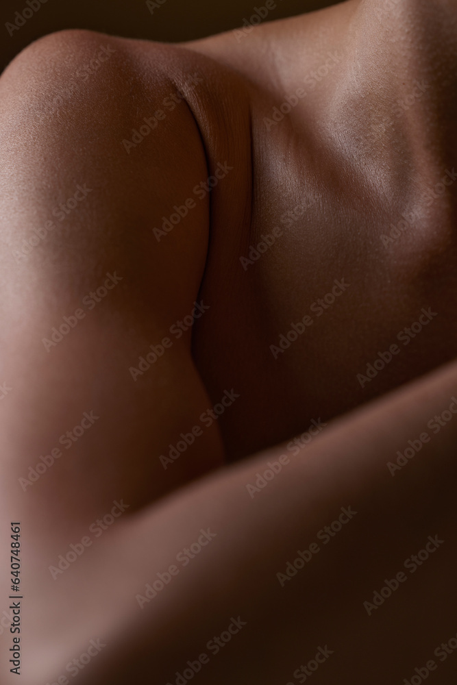 Body, closeup and healthy skin of black woman, shoulder or natural glow from skincare in studio with