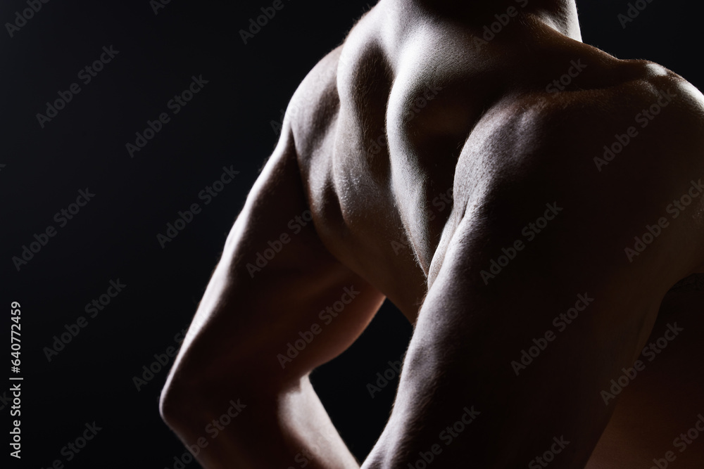 Man, back and shirtless in dark studio with shadow for wellness, health and strong by black backgrou