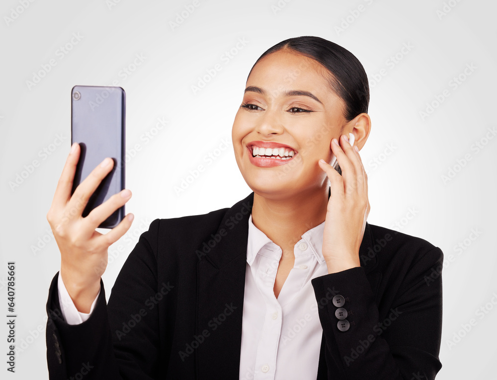 Video call, phone and earphones with a business woman in studio on a white background for communicat