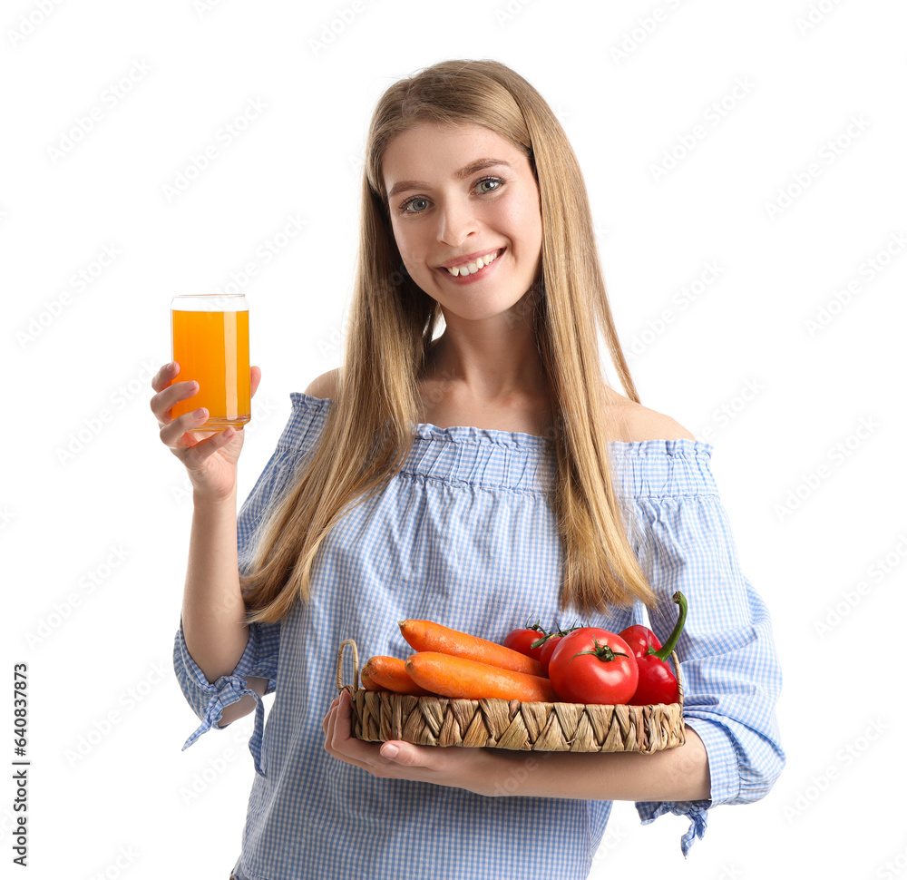 Young woman with vegetables and glass of juice on white background