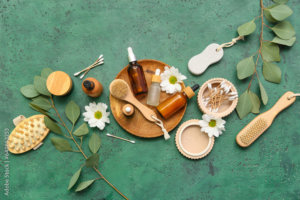 Composition with cosmetic products, bath supplies and flowers on color background