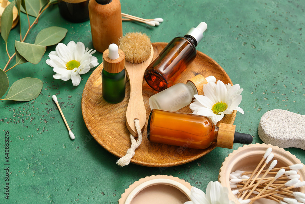 Composition with cosmetic products, bath supplies and flowers on color background