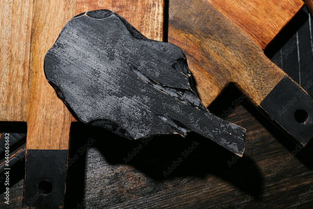 Different cutting boards on wooden background