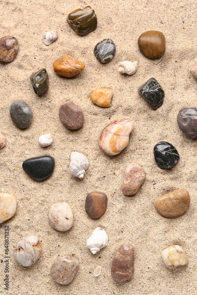 Many pebble stones on sand