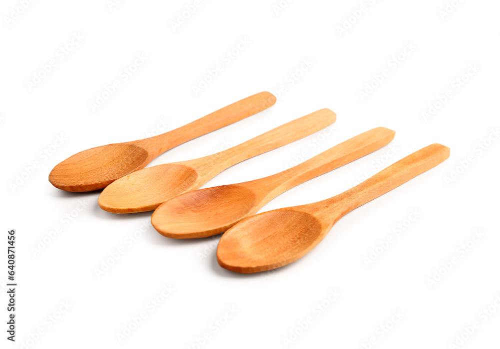 Empty wooden spoons isolated on white background