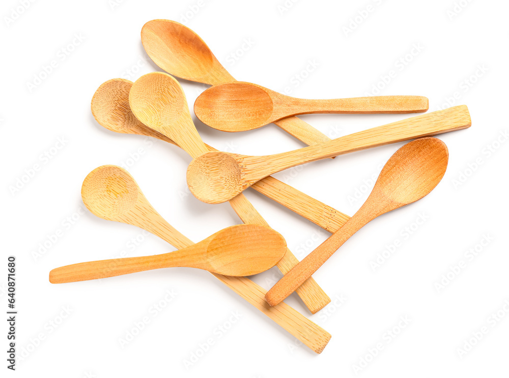 Heap of wooden spoons isolated on white background