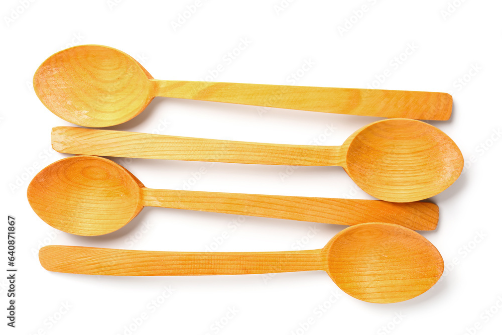 Composition with wooden spoons isolated on white background