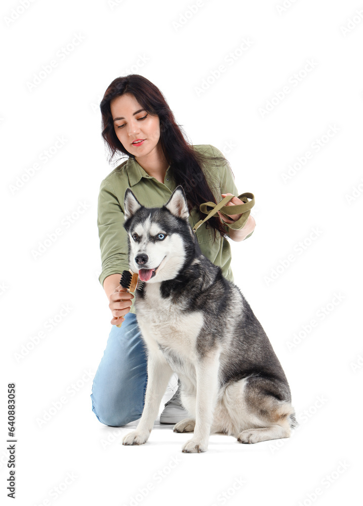 Young woman with Husky dog on white background