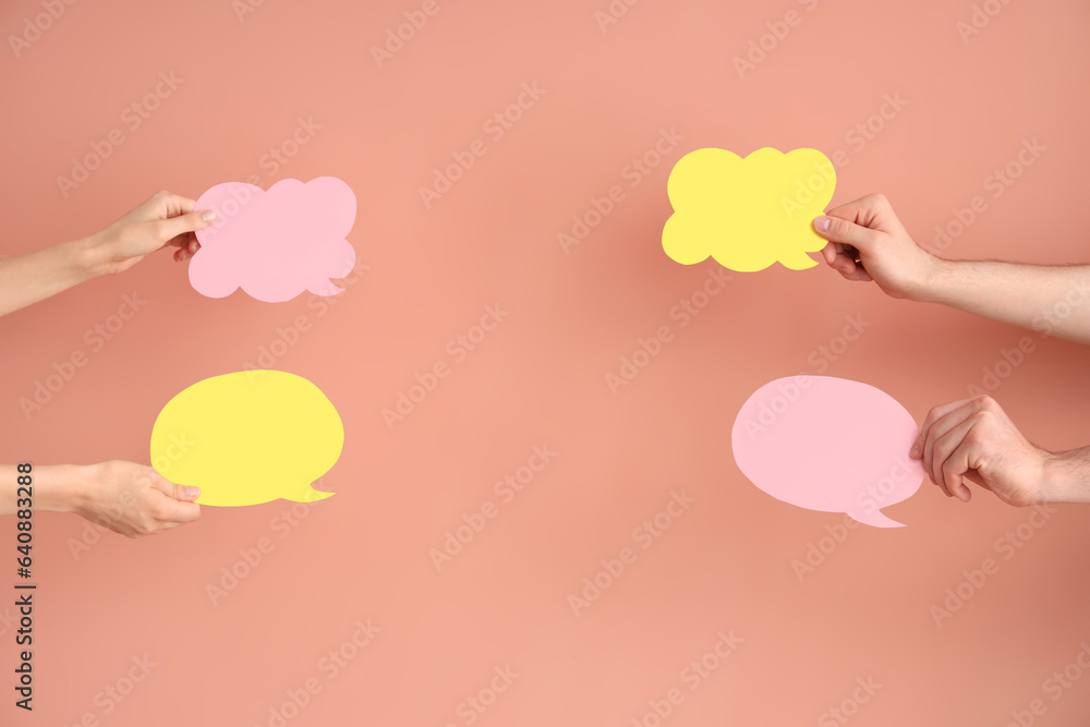 Different hands with speech bubbles on red background