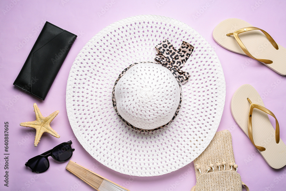 Composition with beach accessories on lilac background