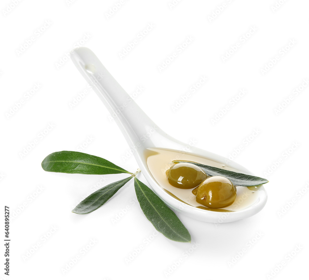 Spoon of fresh olive oil on white background