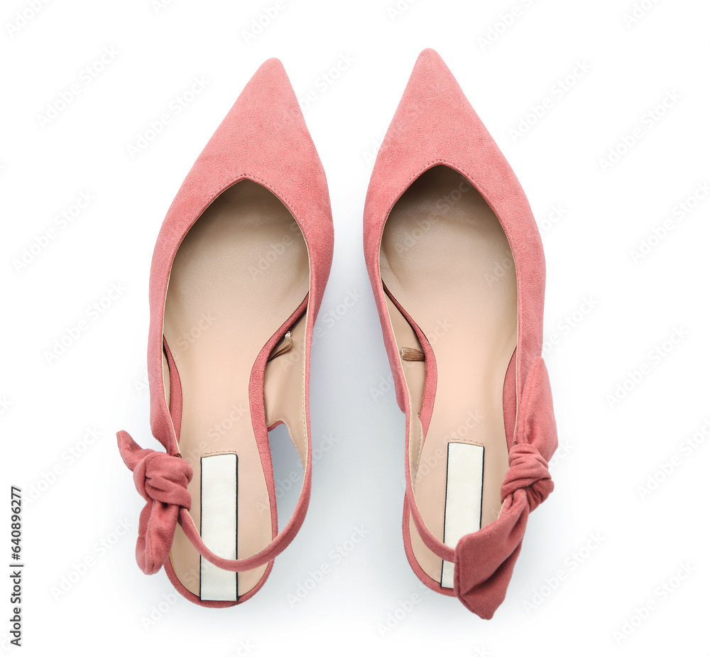 Stylish pink shoes on white background