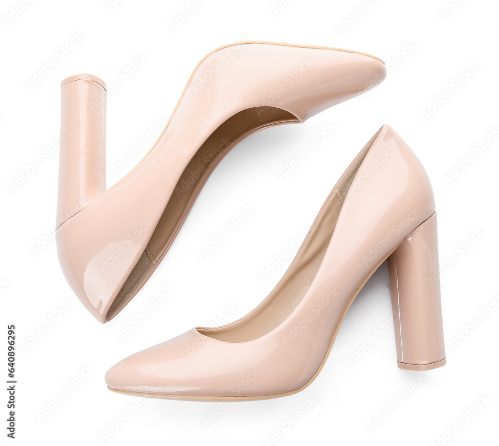 Stylish beige high heels on white background