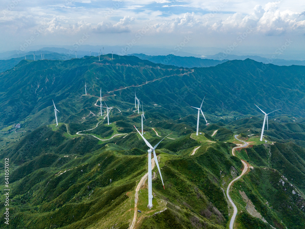 Wind power on the mountain, blue sky and white clouds