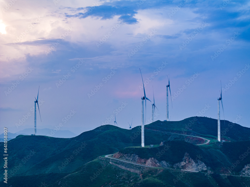 Wind power on the mountain, blue sky and white clouds