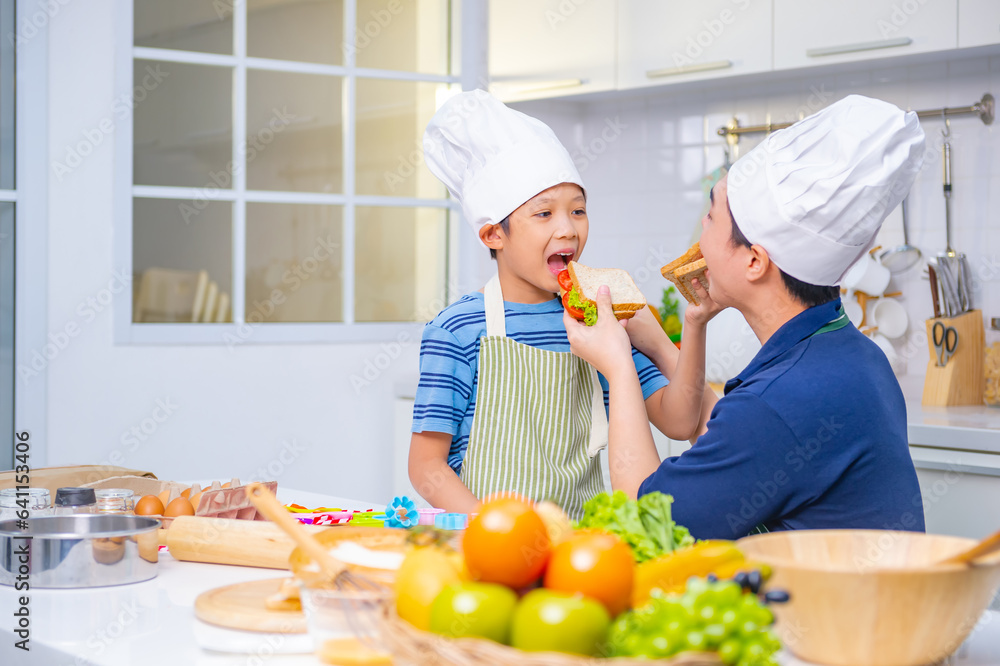 father and son cooking