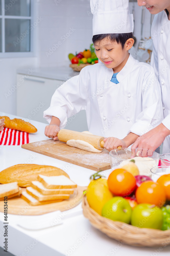 father and son cooking