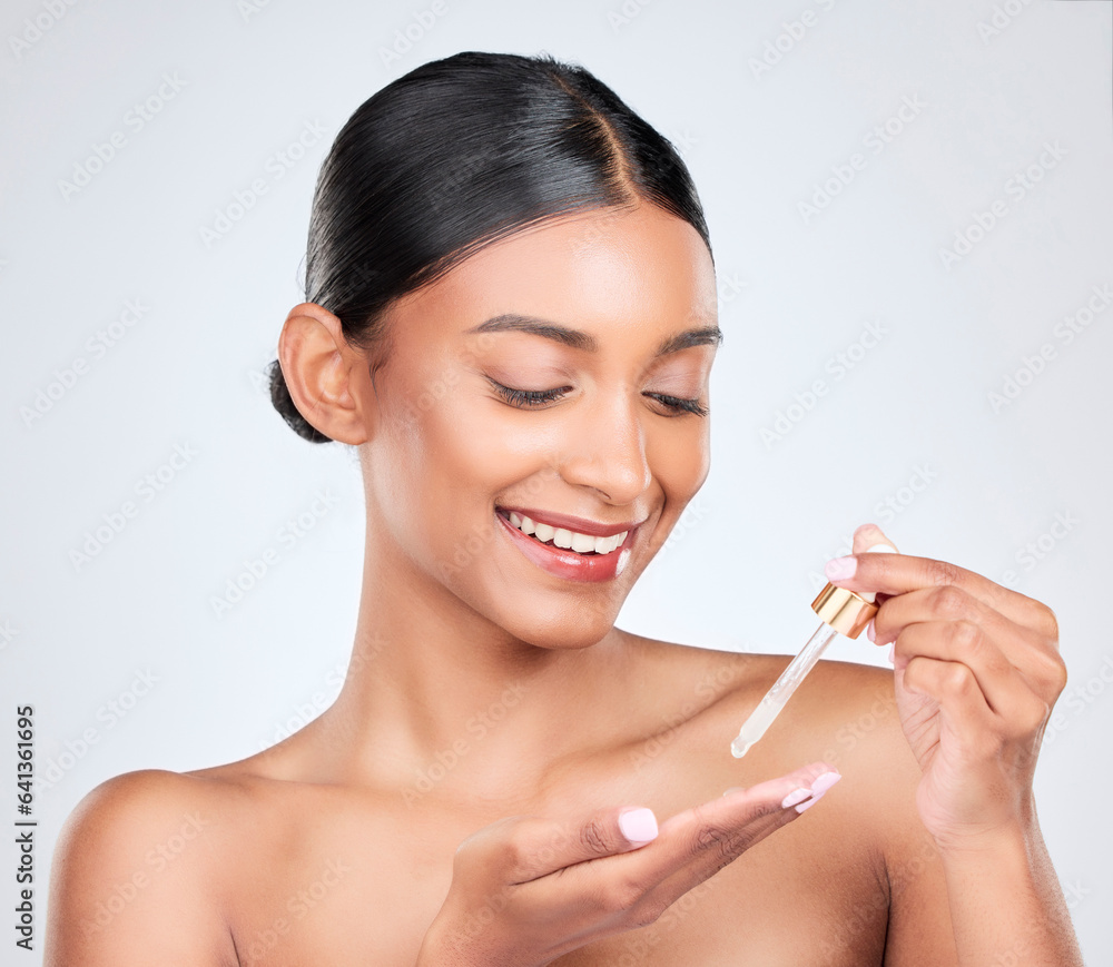 Smile, skincare and a woman with oil on a white background for wellness, glow or hydration. Happy, d