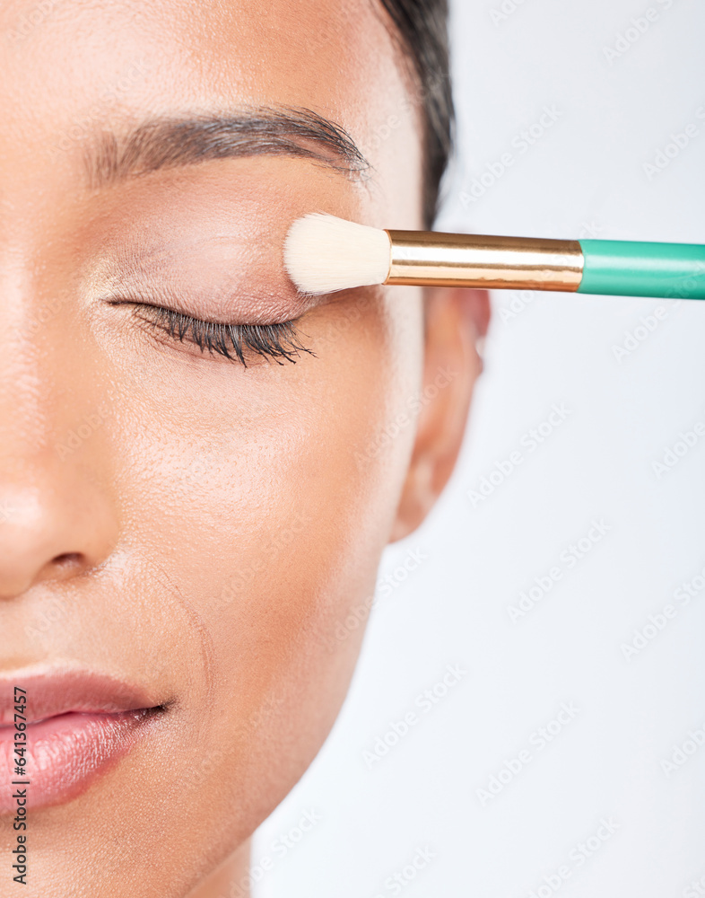 Woman, makeup and eye brush in studio for beauty, skincare or apply facial powder on white backgroun