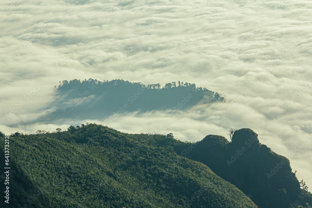 Sunrise, morning fog and the mountain