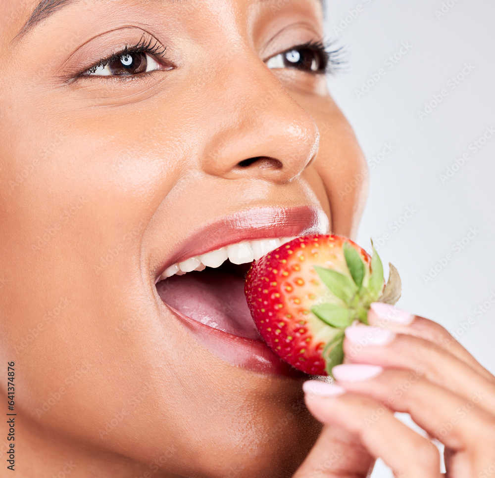 Eating healthy, diet and a woman with a strawberry on a white background for nutrition and hungry. S