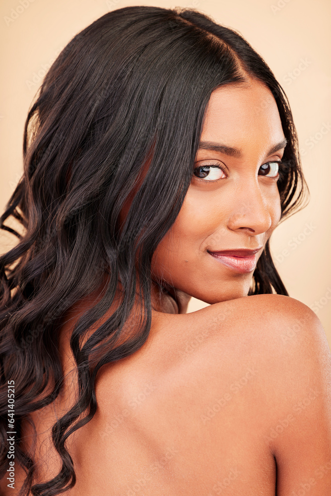 Hair care, beauty and face of woman in studio isolated on a brown background. Curly hairstyle, natur