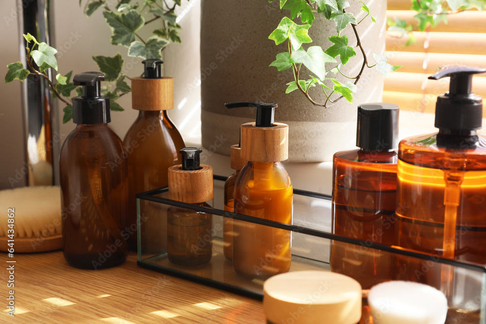 Bath accessories on table in room, closeup