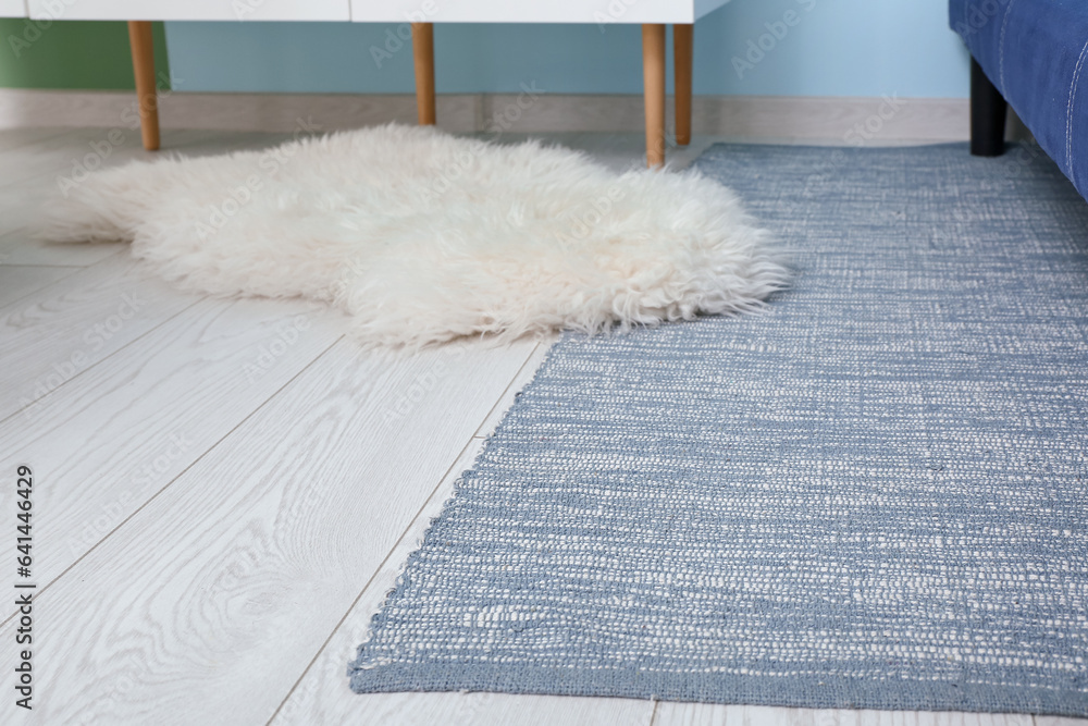 Soft rugs on floor in living room, closeup