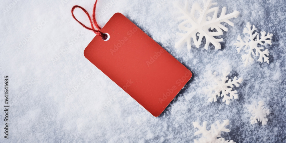 Empty pale red gift tag. Paper label on a snowy background. Minimal winter still life. Christmas, se