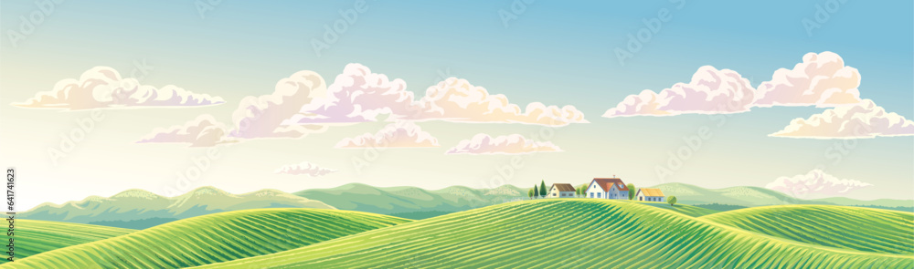 Summer rural landscape panoramic format, with hills and agriculture fields and village, on top of a 