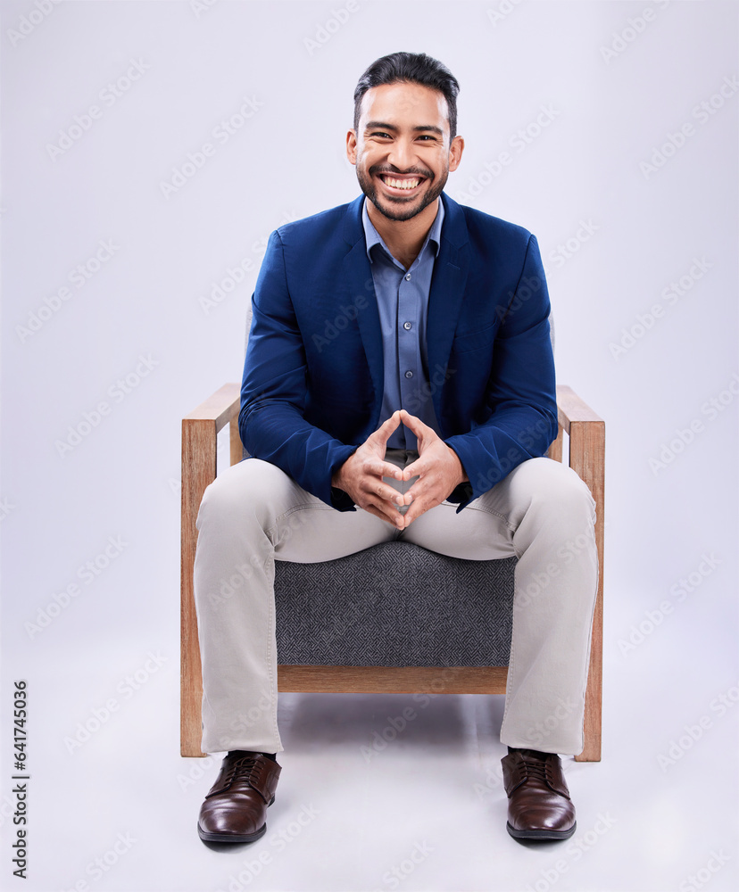 Portrait, smile and business man on chair in studio isolated on a white background mockup space. Pro