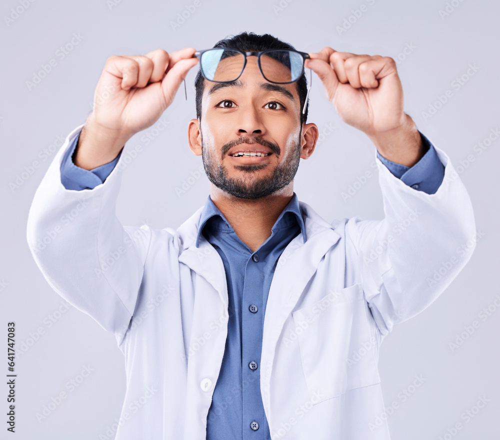 Man, glasses and vision of ophthalmologist at studio isolated on a white background. Frame, spectacl