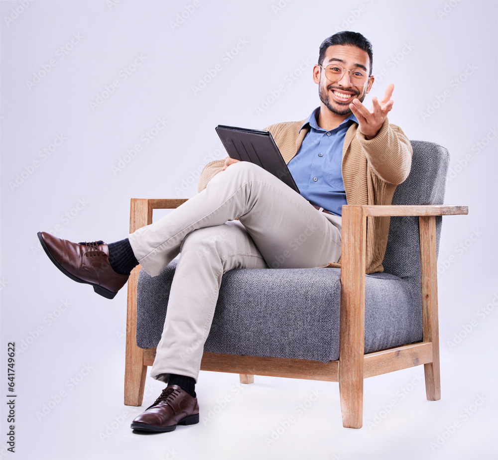 Portrait, tablet and a man psychologist in a chair on a white background in studio to listen for dia